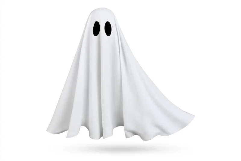 Floating ghost costume made from white sheet with black eye holes isolated on white background