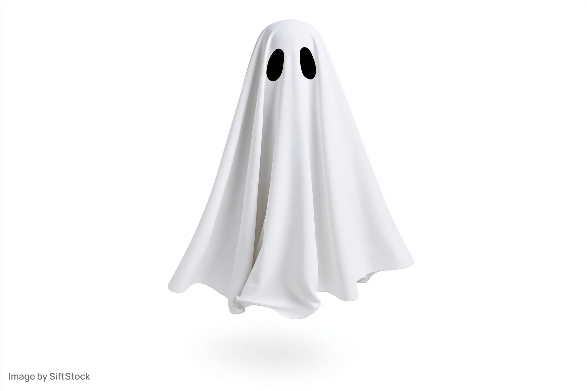 Floating ghost costume made from white sheet with black eye holes isolated on white background