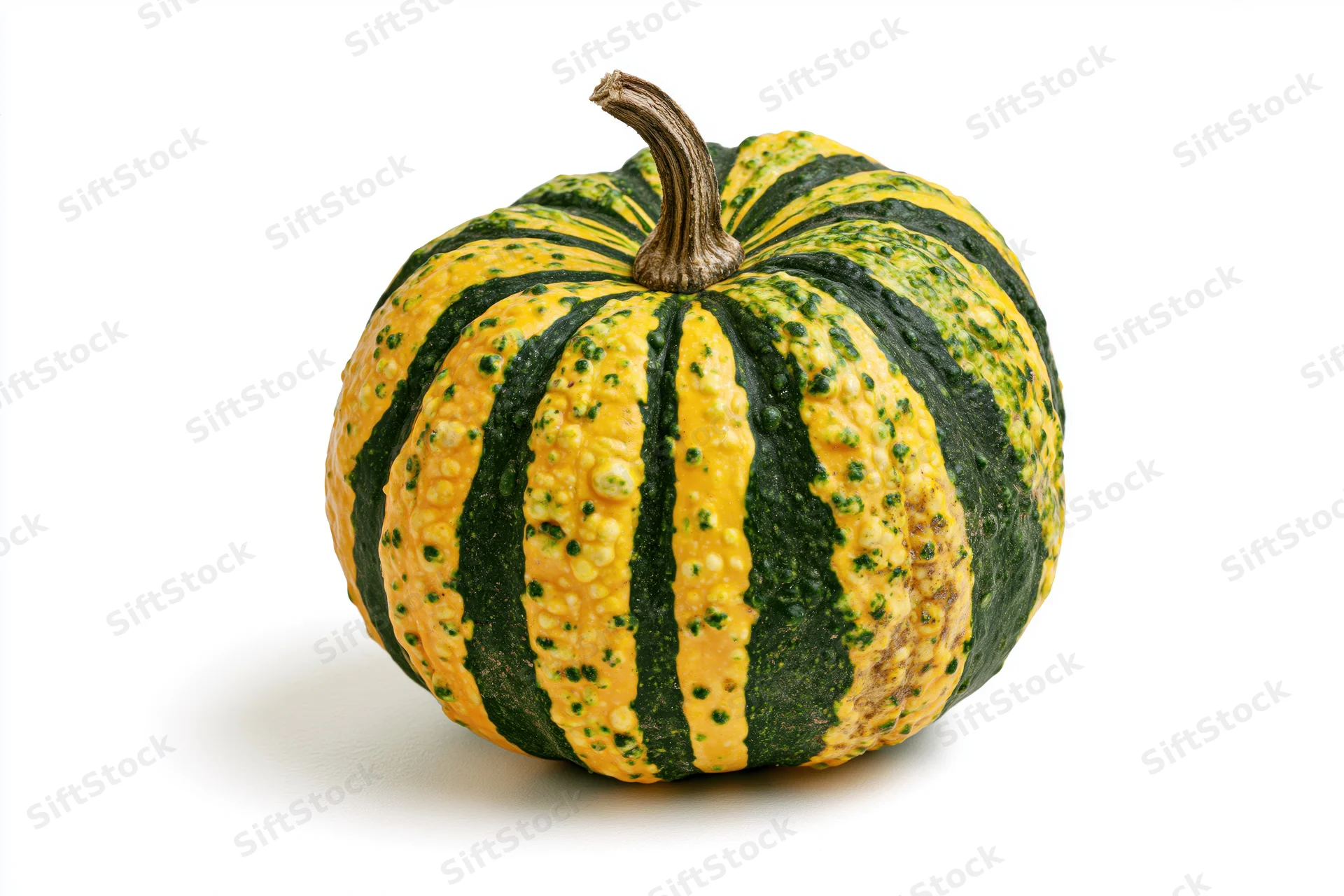 Ornamental gourd with green and yellow stripes on white background