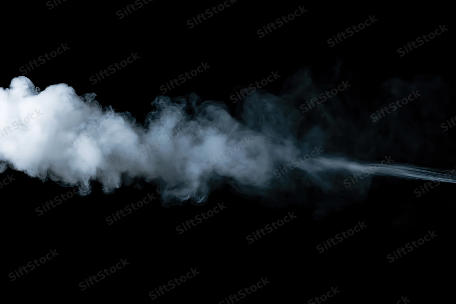 White smoke drifting horizontally against black background