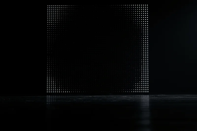 Glowing led dot matrix panel on dark reflective surface