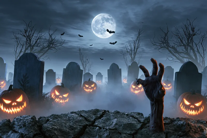 Zombie hand emerging from cracked ground in a foggy graveyard with glowing jack-o-lanterns and tombstones under a full moon