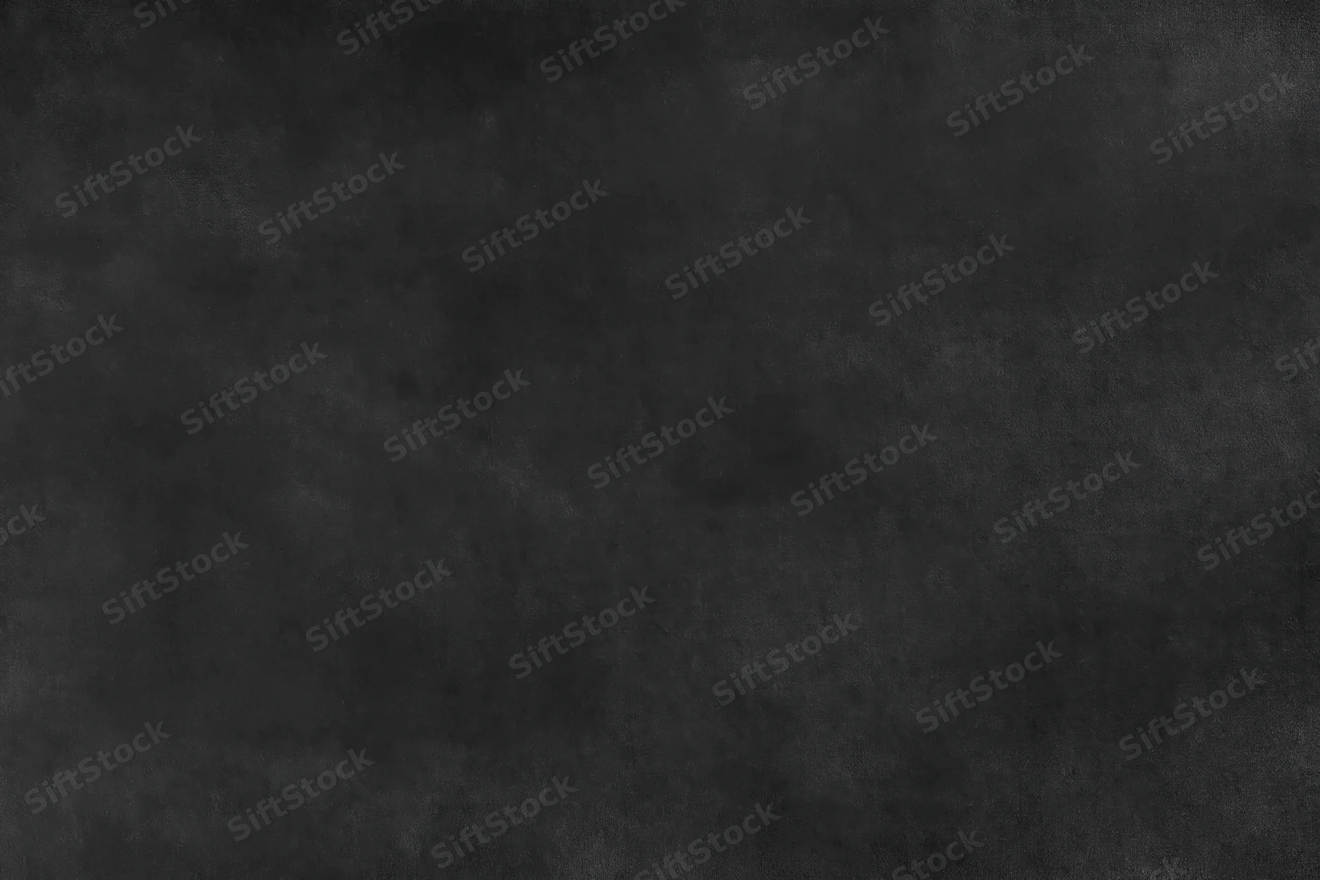 Close-up of a dark black textured surface with subtle grain and matte finish