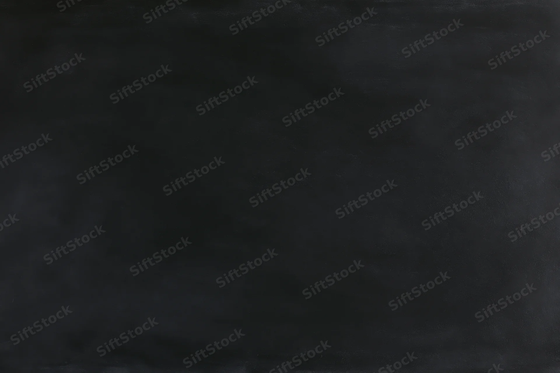 Close-up of a dark blackboard surface in a flat lay arrangement