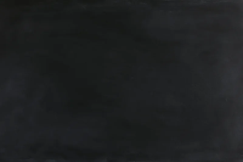 Close-up of a dark blackboard surface in a flat lay arrangement