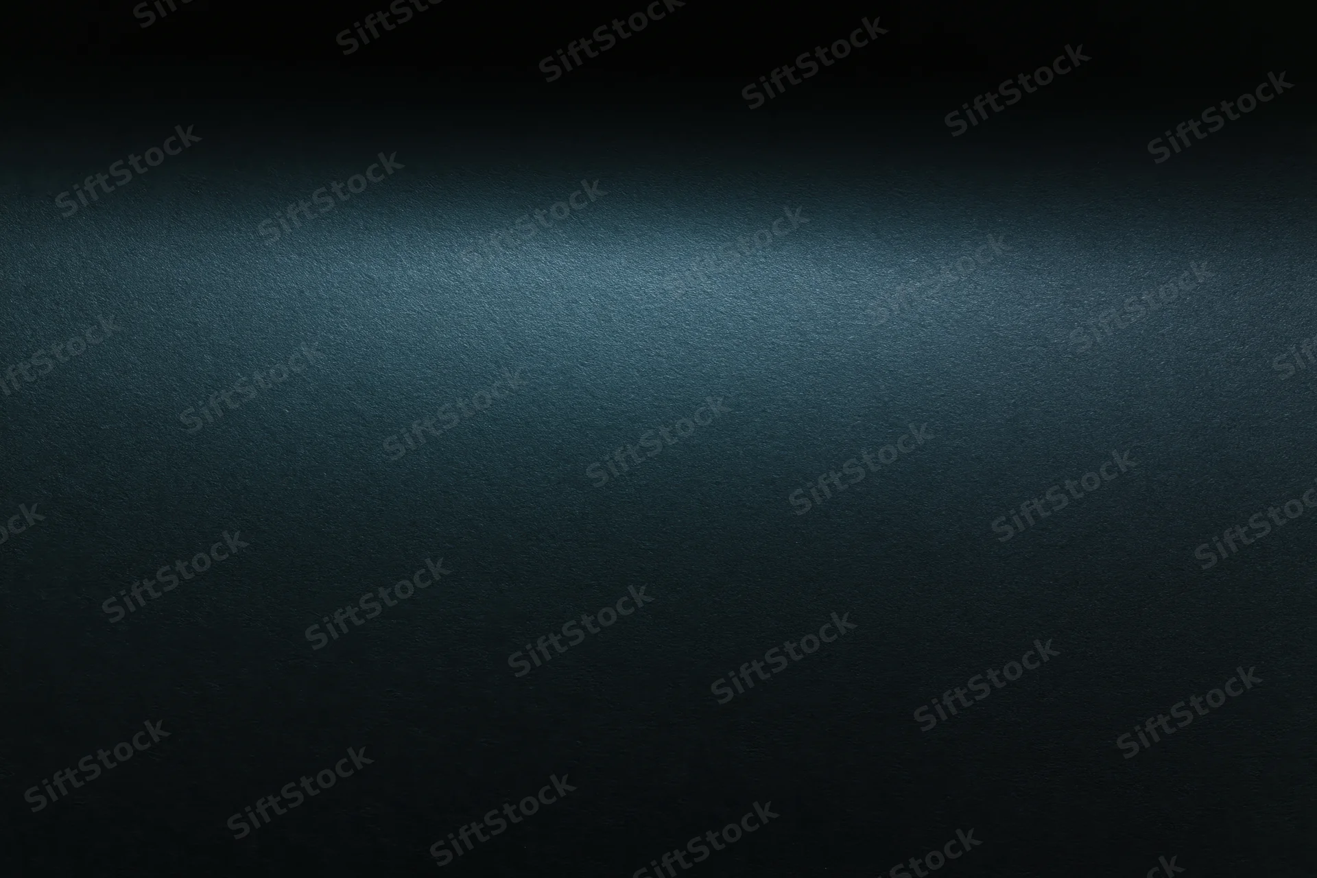 Dark matte surface with subtle gradient and texture, flat lay view