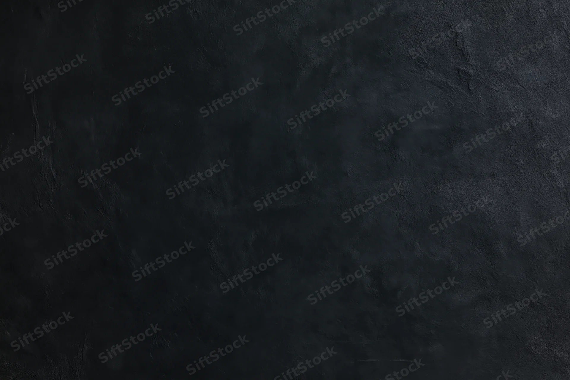 Dark textured concrete wall surface for interior design