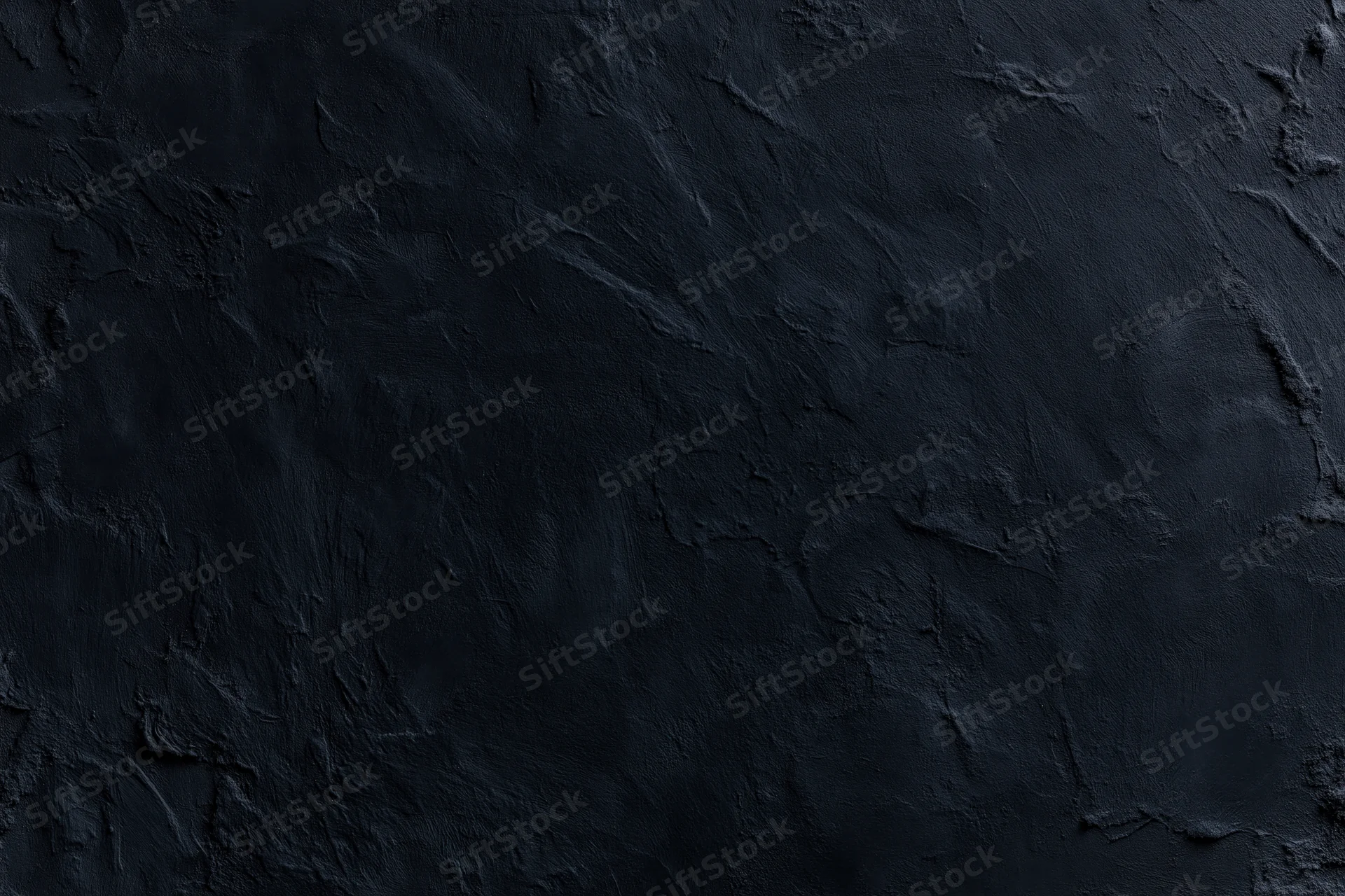 Close-up of dark textured wall surface with rough uneven finish