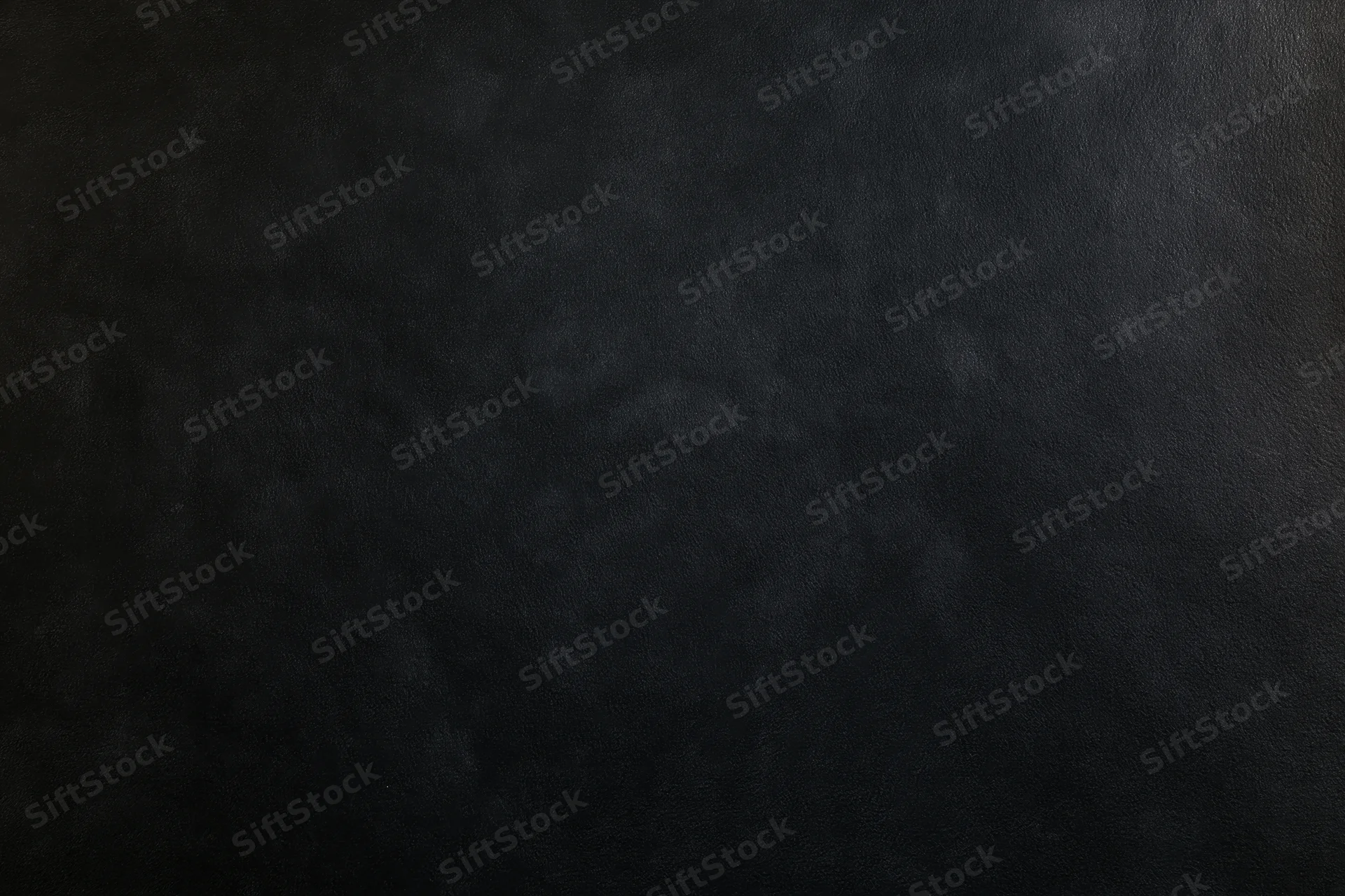 Close-up of a matte black textured surface filling the frame