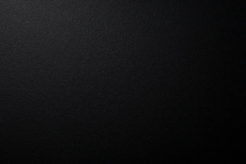 Close-up of a matte black textured surface filling the frame