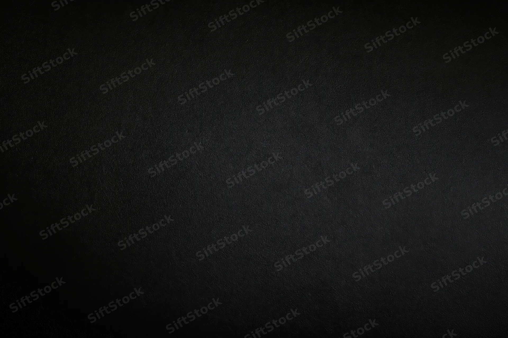 Close-up of a matte black textured surface filling the frame