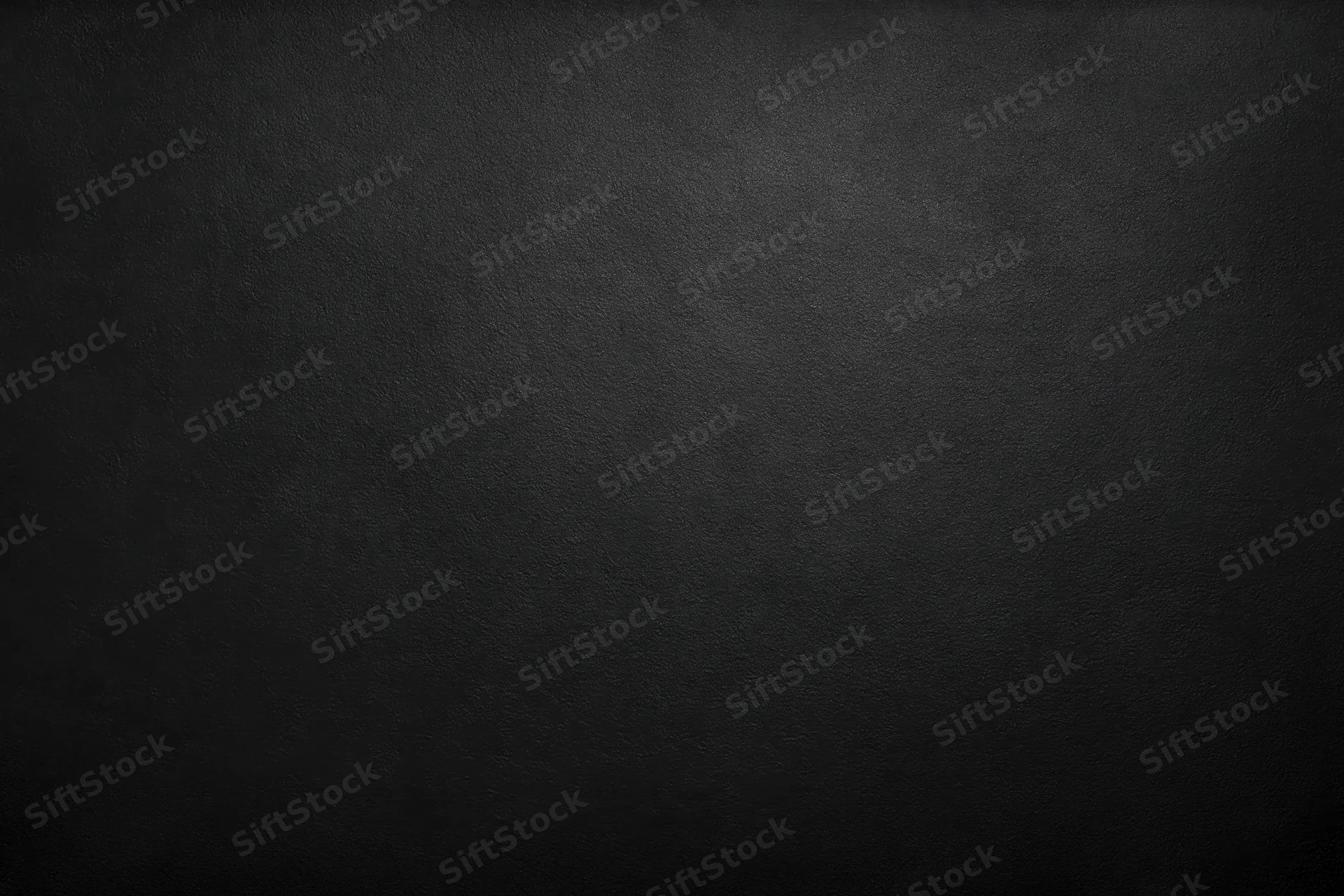 Close-up of a matte black textured surface filling the frame