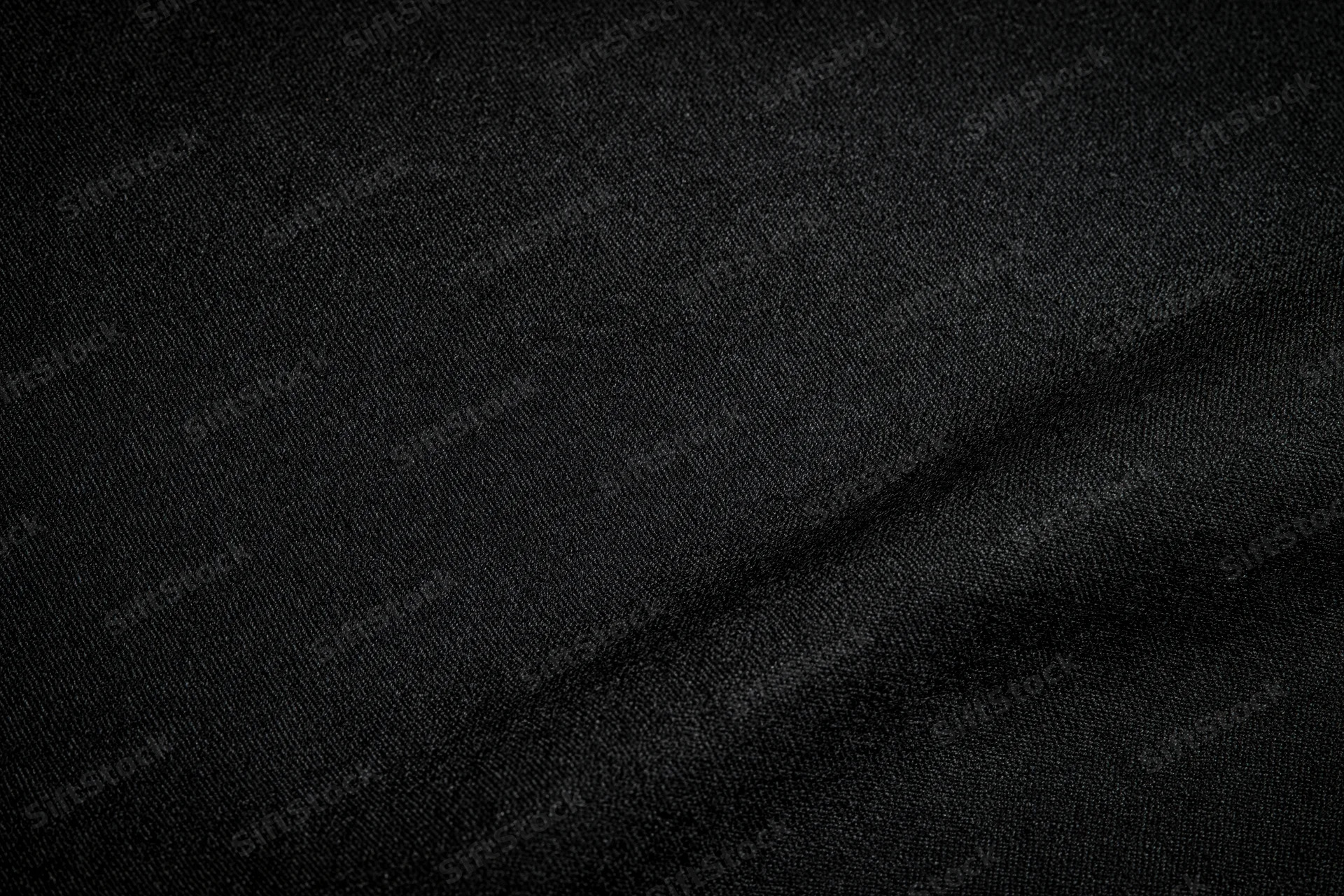 Close-up of black woven fabric texture filling the frame