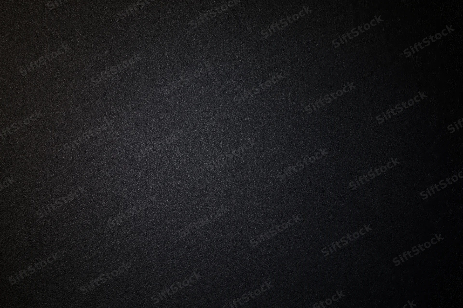 Close-up of matte black textured paper surface in flat lay arrangement