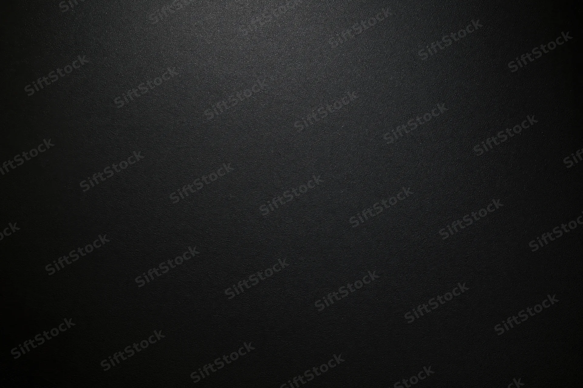 Close-up of matte black textured paper surface in flat lay arrangement