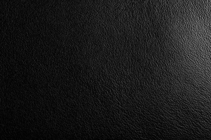 Close-up of black leather texture filling the frame