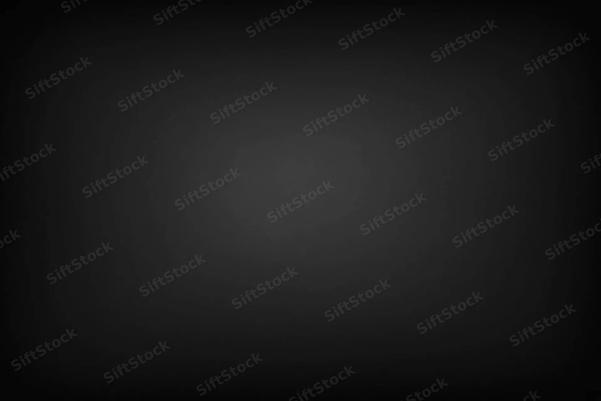 Dark charcoal matte surface filling the frame flat-on