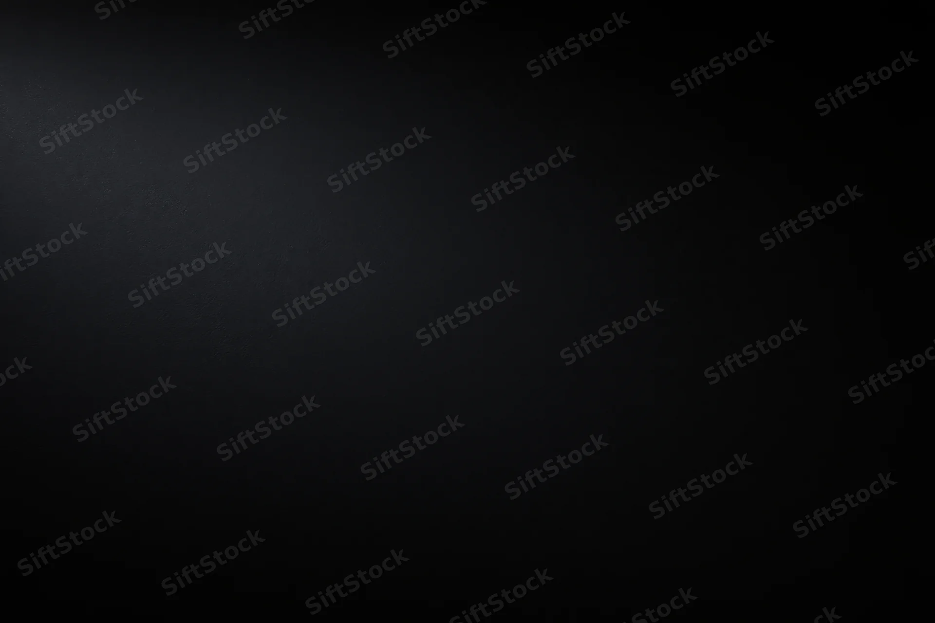 Dark charcoal matte surface filling the frame flat-on