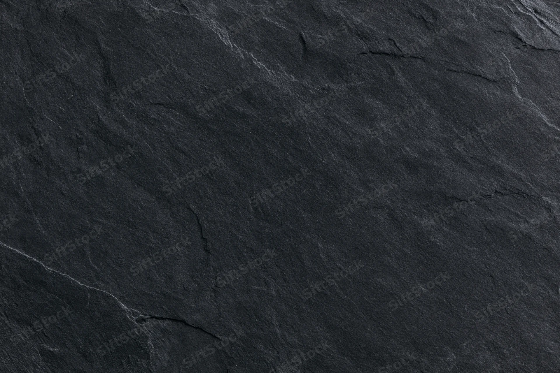 Dark slate stone surface texture filling the entire frame