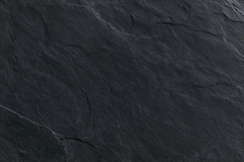 Dark slate stone surface texture filling the entire frame