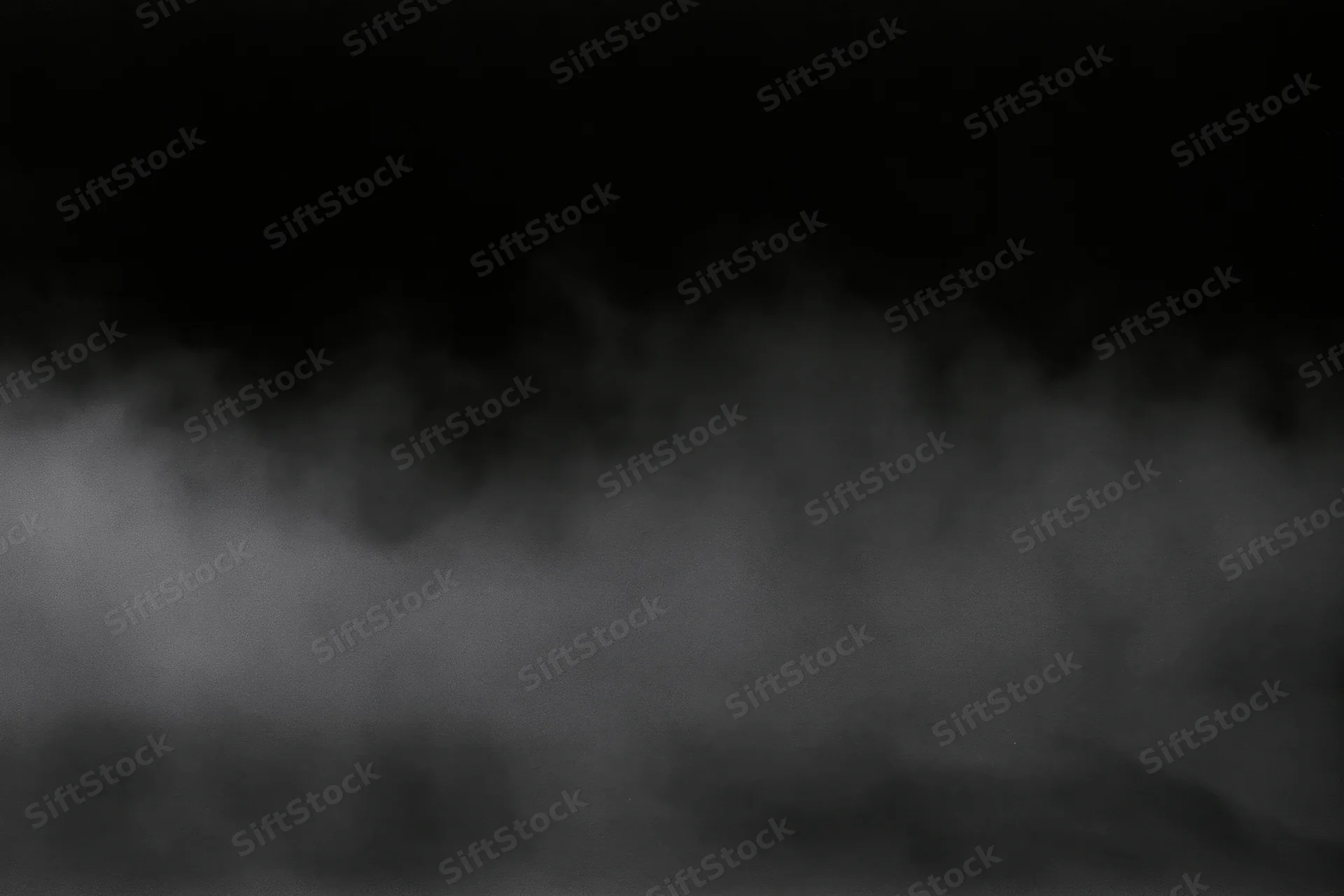 Dense fog drifting across a dark empty surface wide