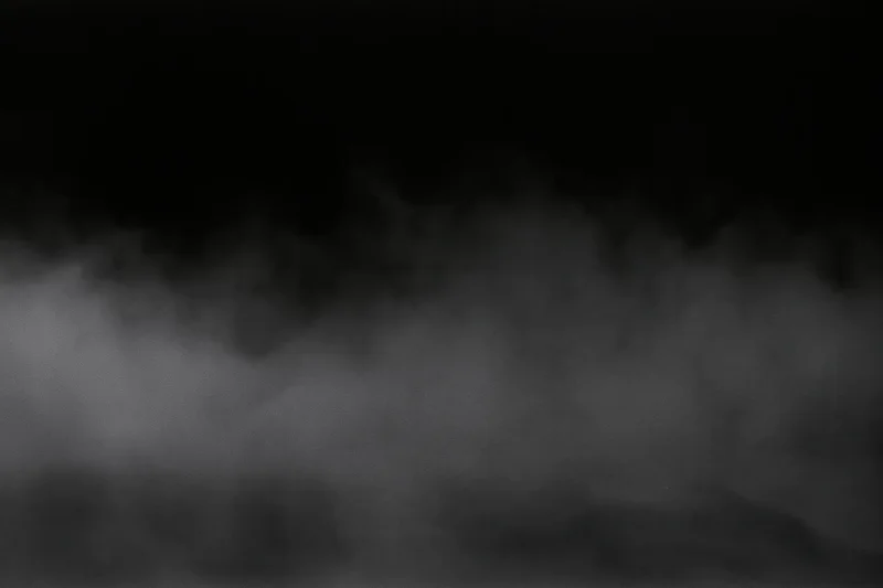 Dense fog drifting across a dark empty surface wide