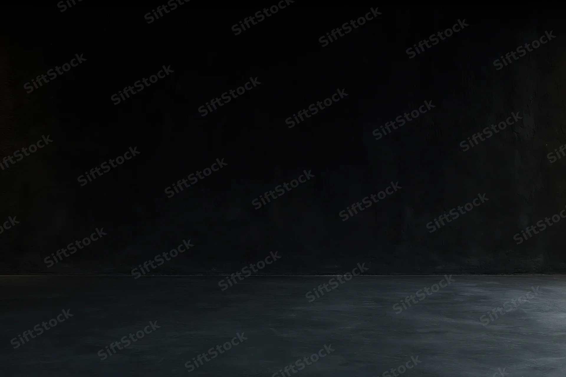 Dark empty room with textured concrete wall and smooth floor