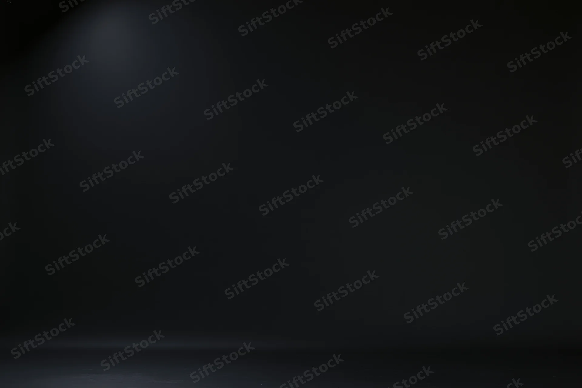 Dark studio backdrop with soft gradient lighting and empty space for product display
