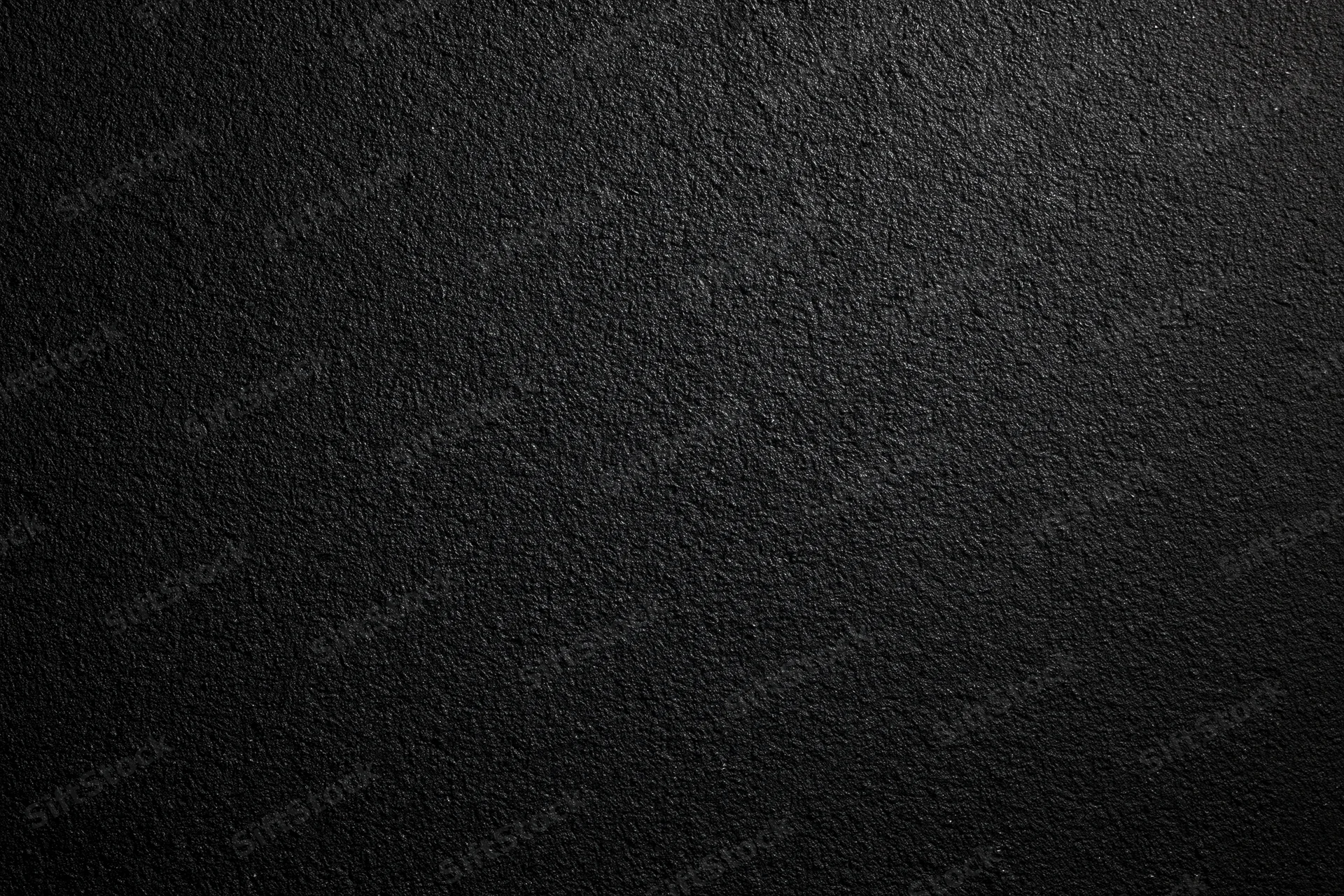 Dark matte textured surface filling the frame