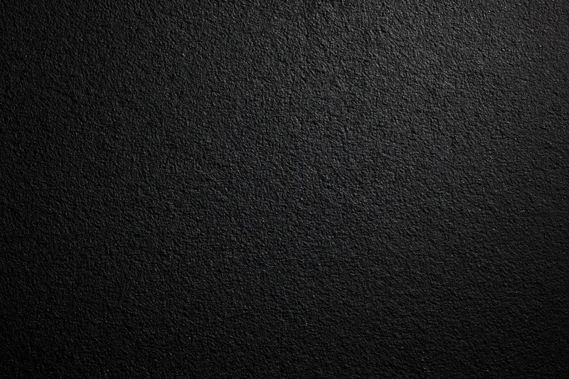 Dark matte textured surface filling the frame