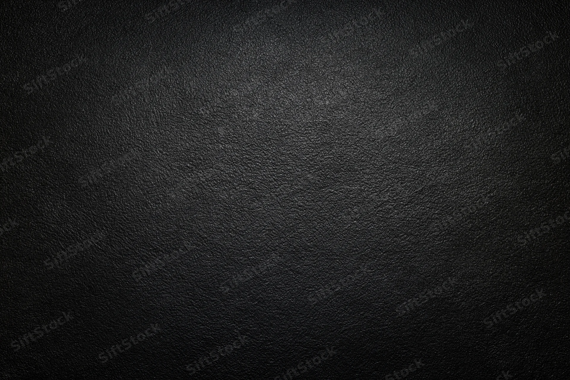 Dark charcoal textured leather surface filling the frame