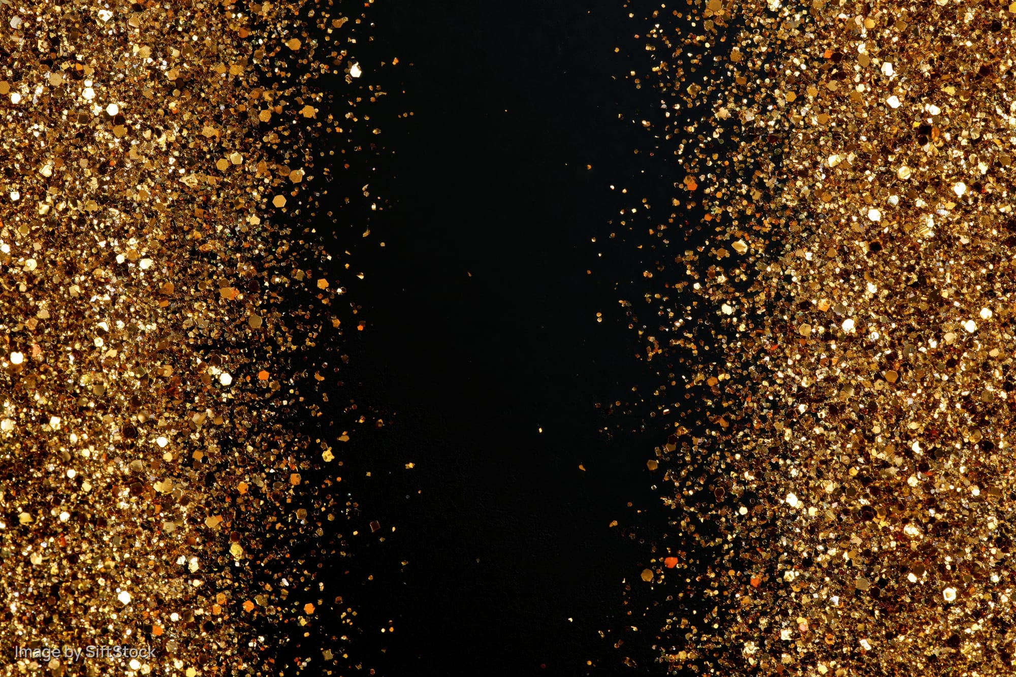Gold glitter particles densely scattered along both left and right sides against a black background