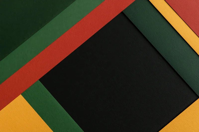 Layered colored paper sheets arranged diagonally in abstract geometric pattern with central black space