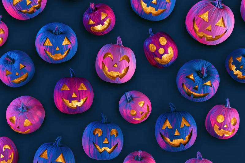 Carved jack-o-lantern pumpkins in blue and purple hues arranged in a repeating pattern on a dark background