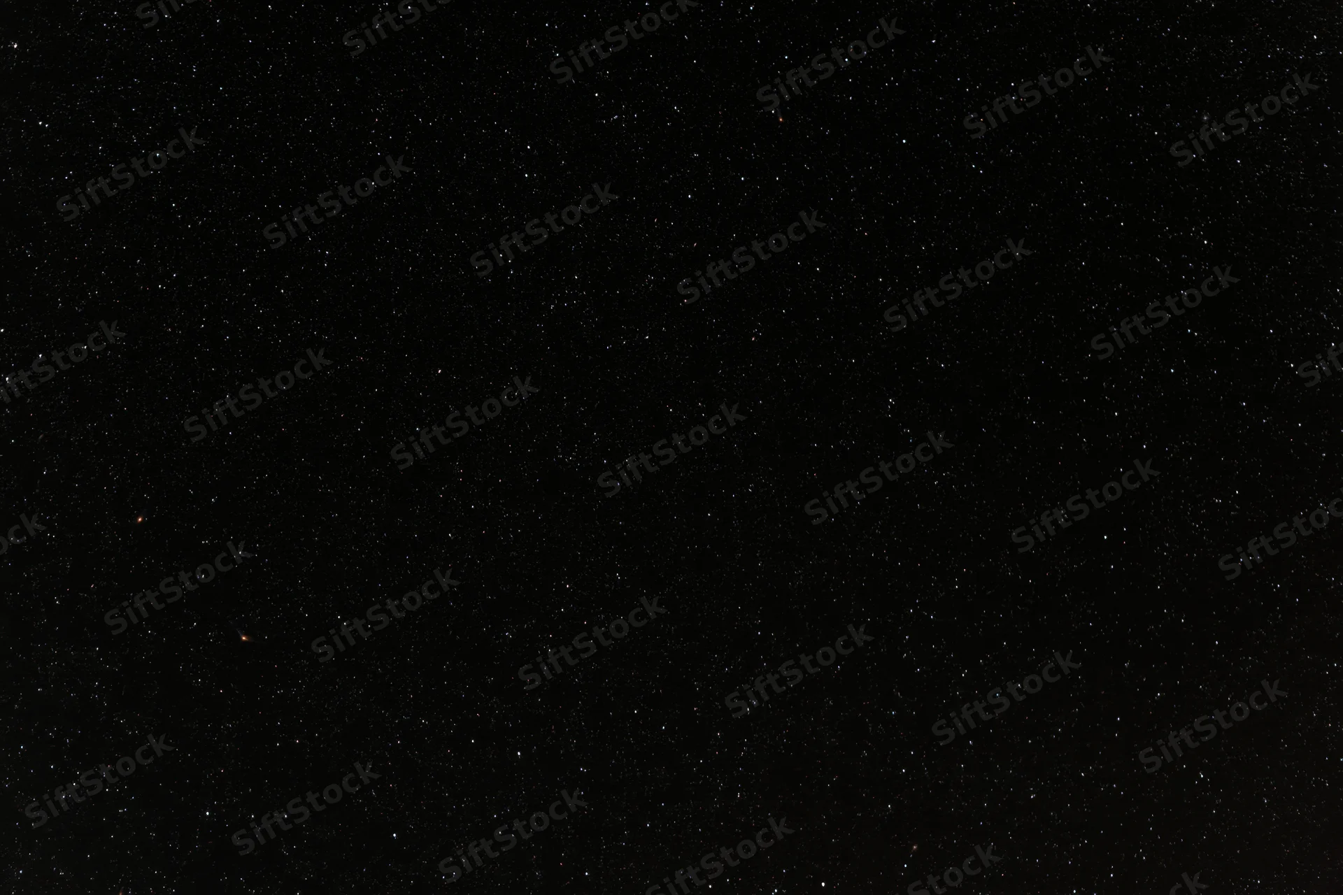 Night sky filled with scattered stars against dark background