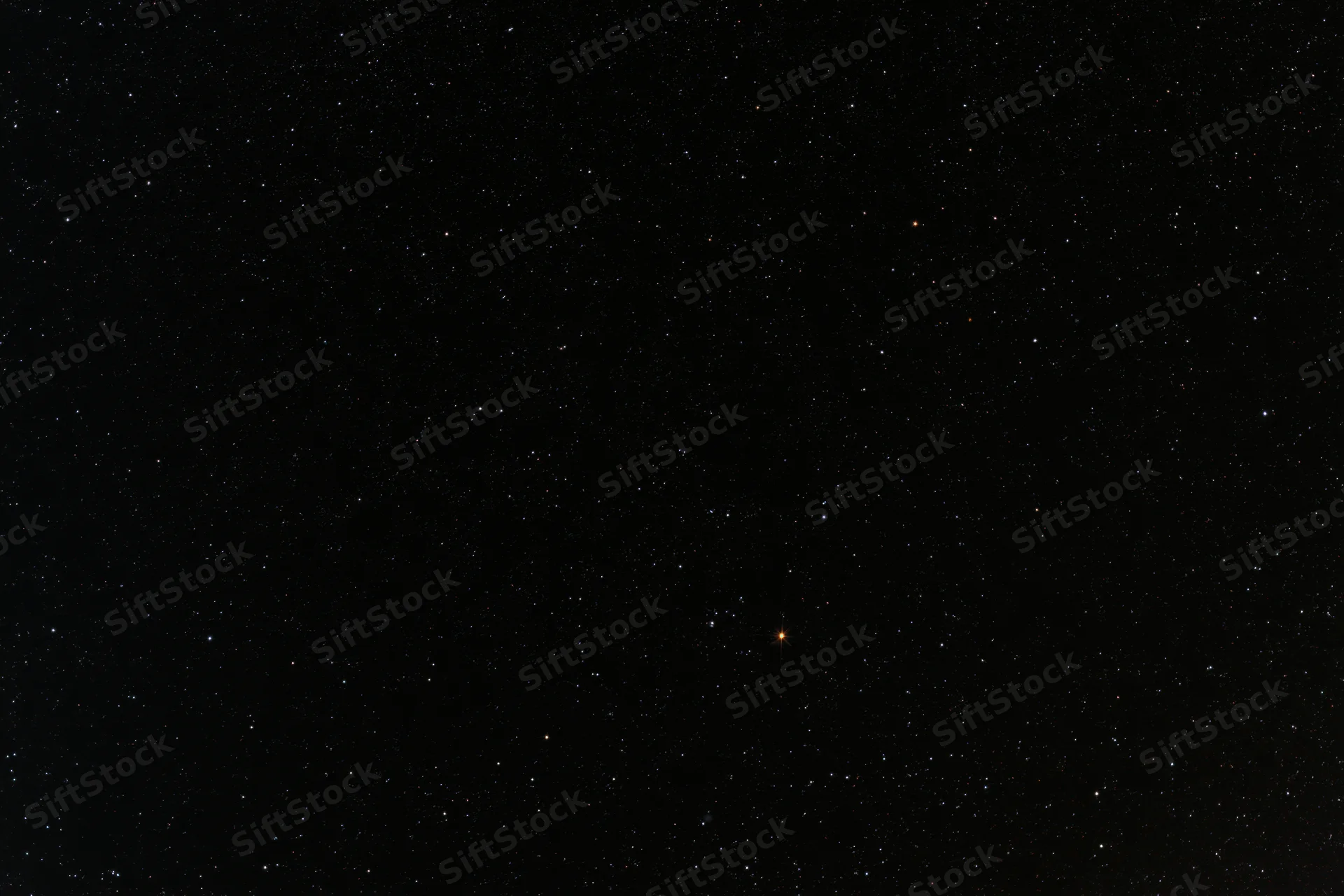 Night sky filled with scattered stars against dark background