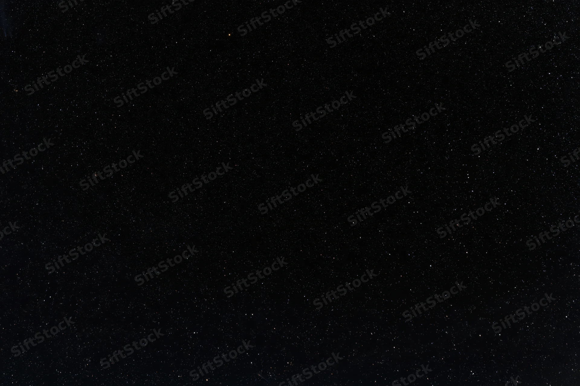 Dark night sky filled with scattered stars across the frame