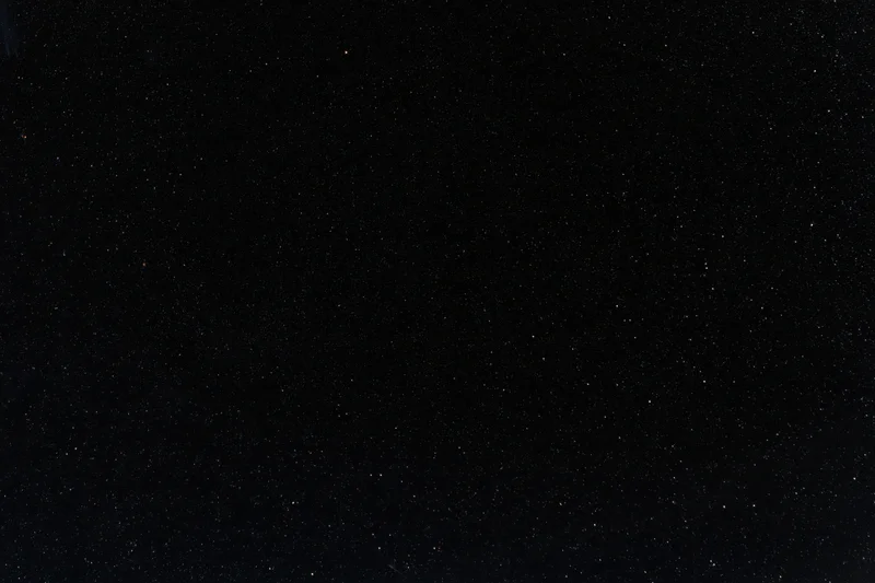 Dark night sky filled with scattered stars across the frame