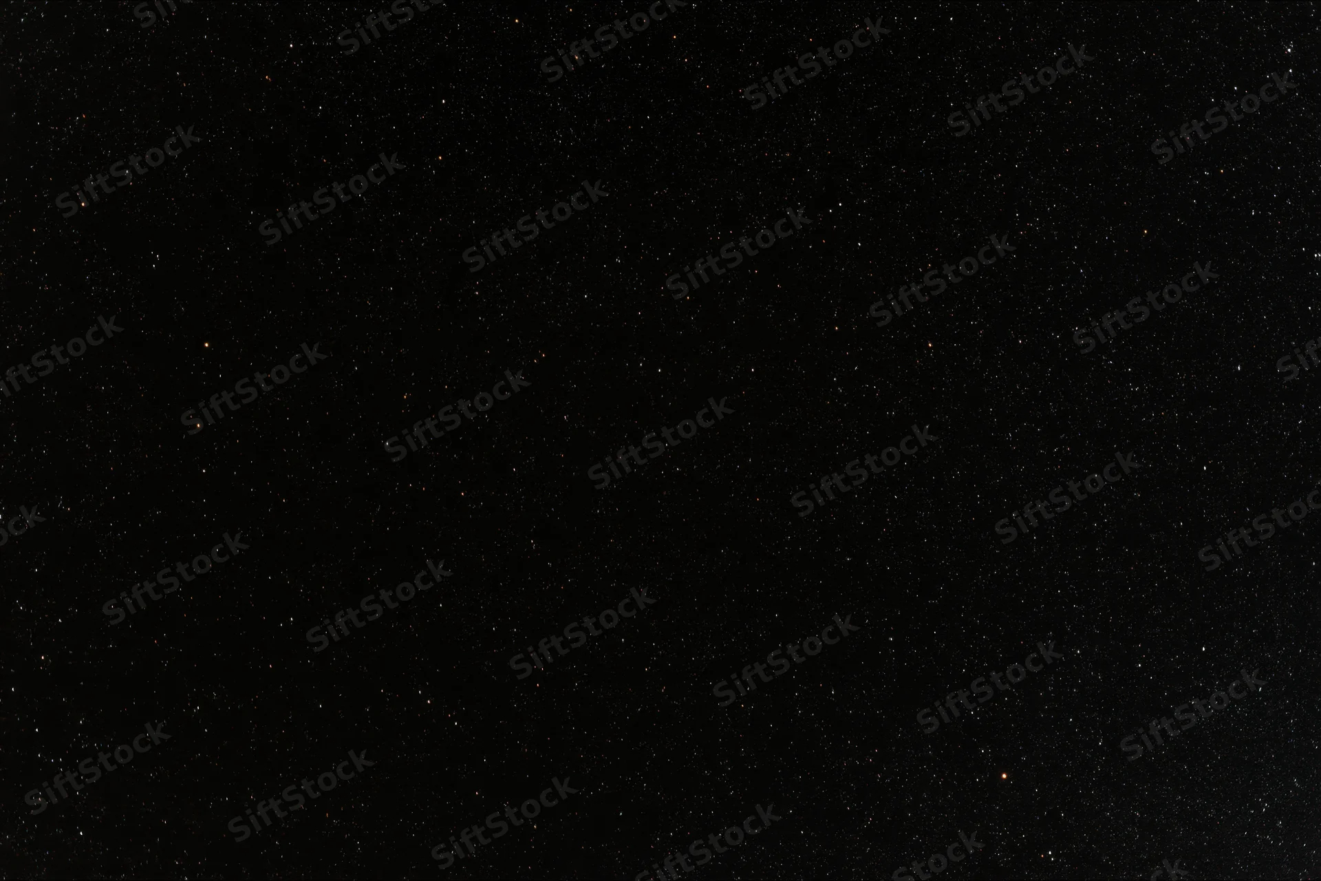 Night sky filled with scattered stars across dark expanse