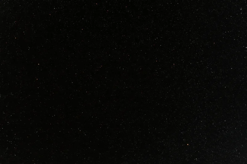 Night sky filled with scattered stars across dark expanse