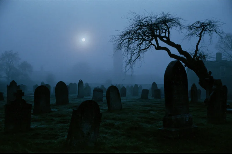 Old cemetery at night with rows of weathered gravestones under moonlight and fog