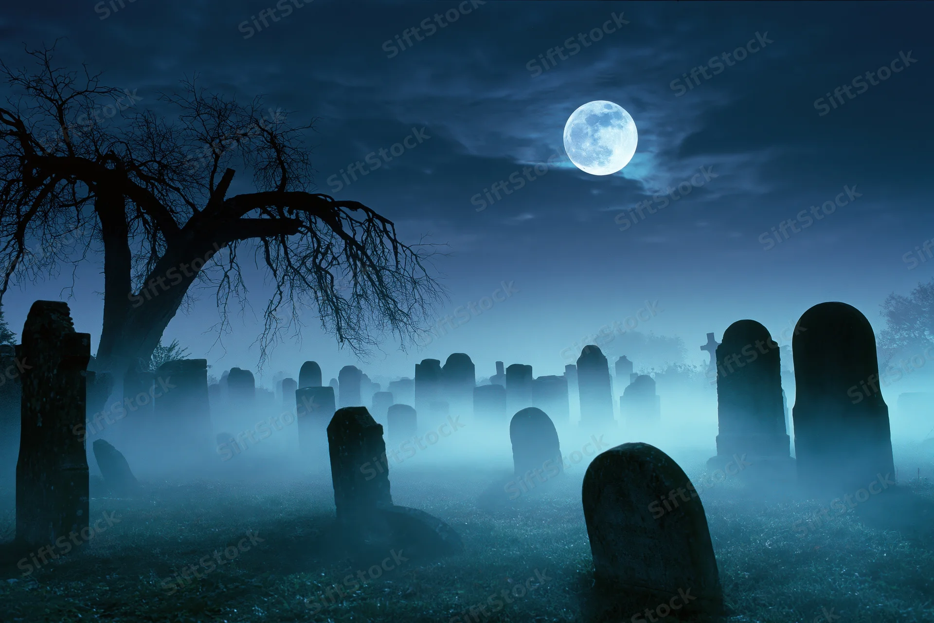 Old cemetery at night with weathered gravestones and bare trees under a full moon in fog