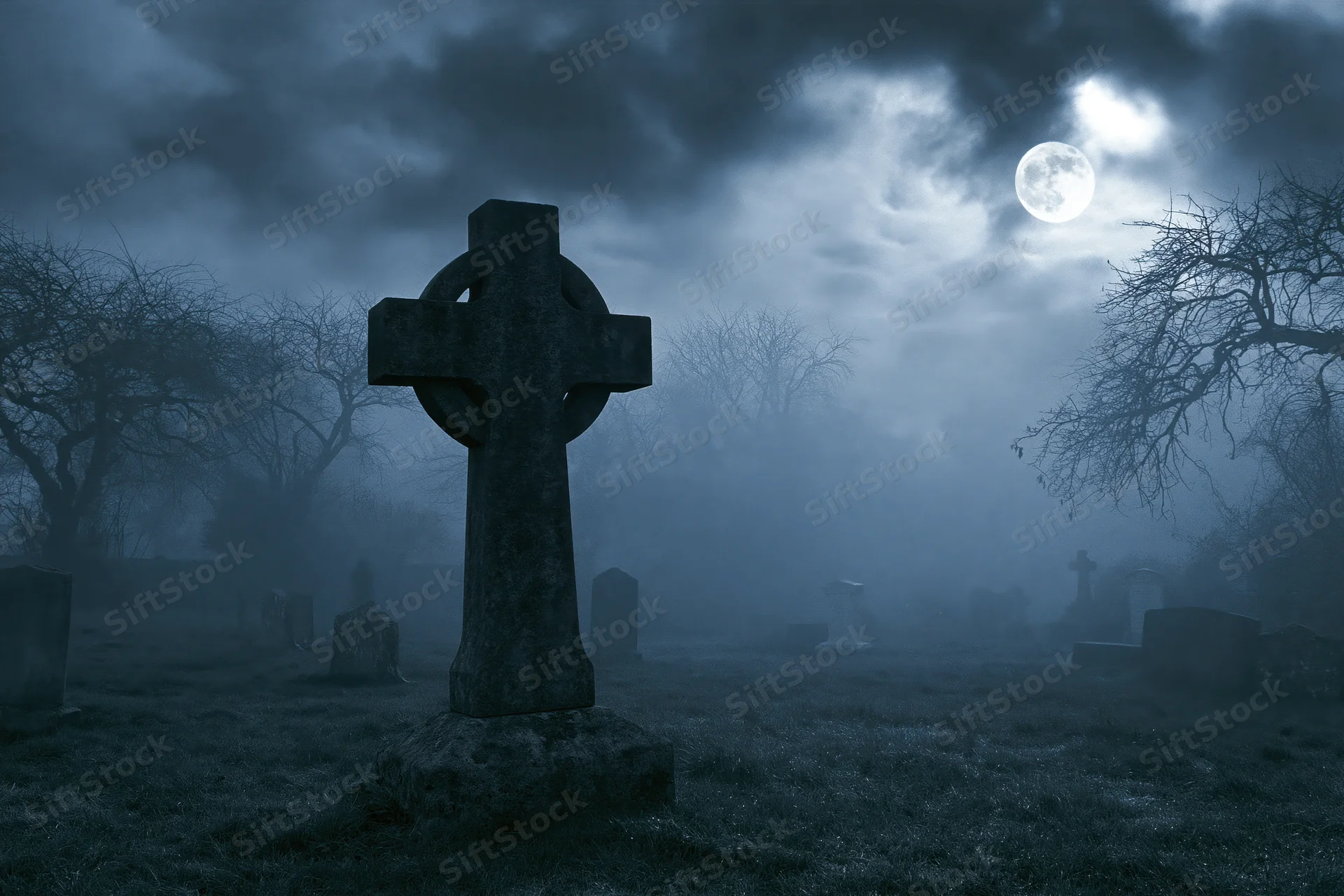 Old stone cross gravestone in foggy cemetery at night under full moon