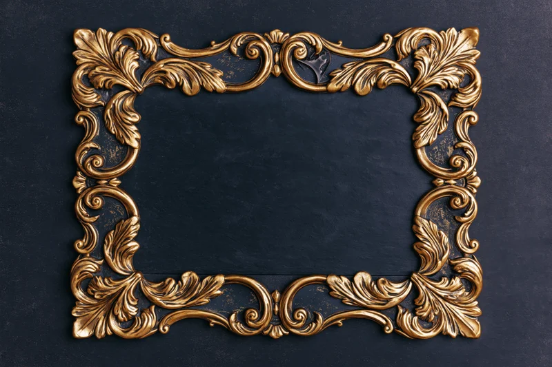Ornate gold baroque frame with raised scrollwork on dark textured background