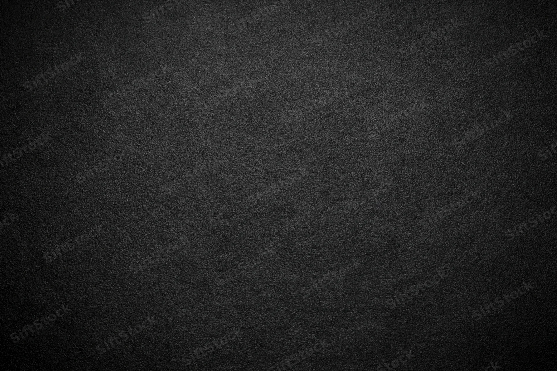 Dark charcoal textured surface filling the frame