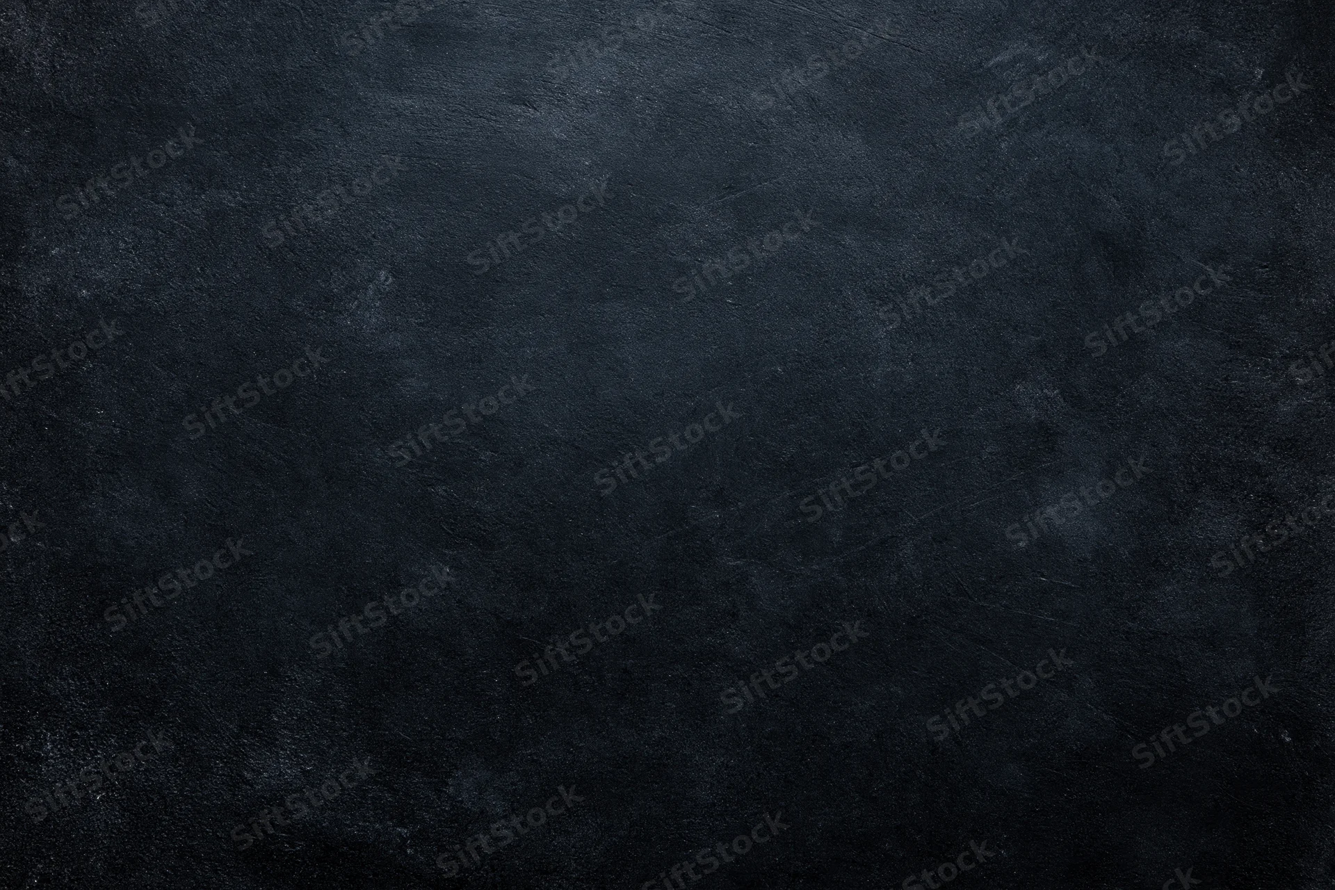 Dark charcoal textured surface filling the frame