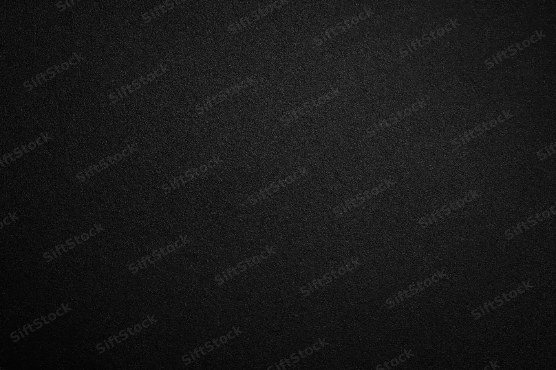 Dark charcoal textured surface filling the frame