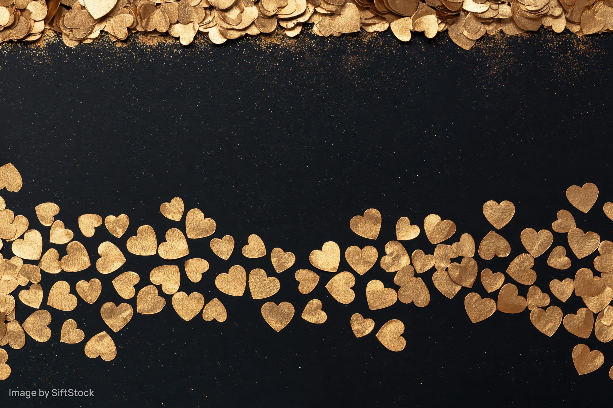 Gold metallic heart confetti arranged in dense horizontal bands along top and bottom of black background