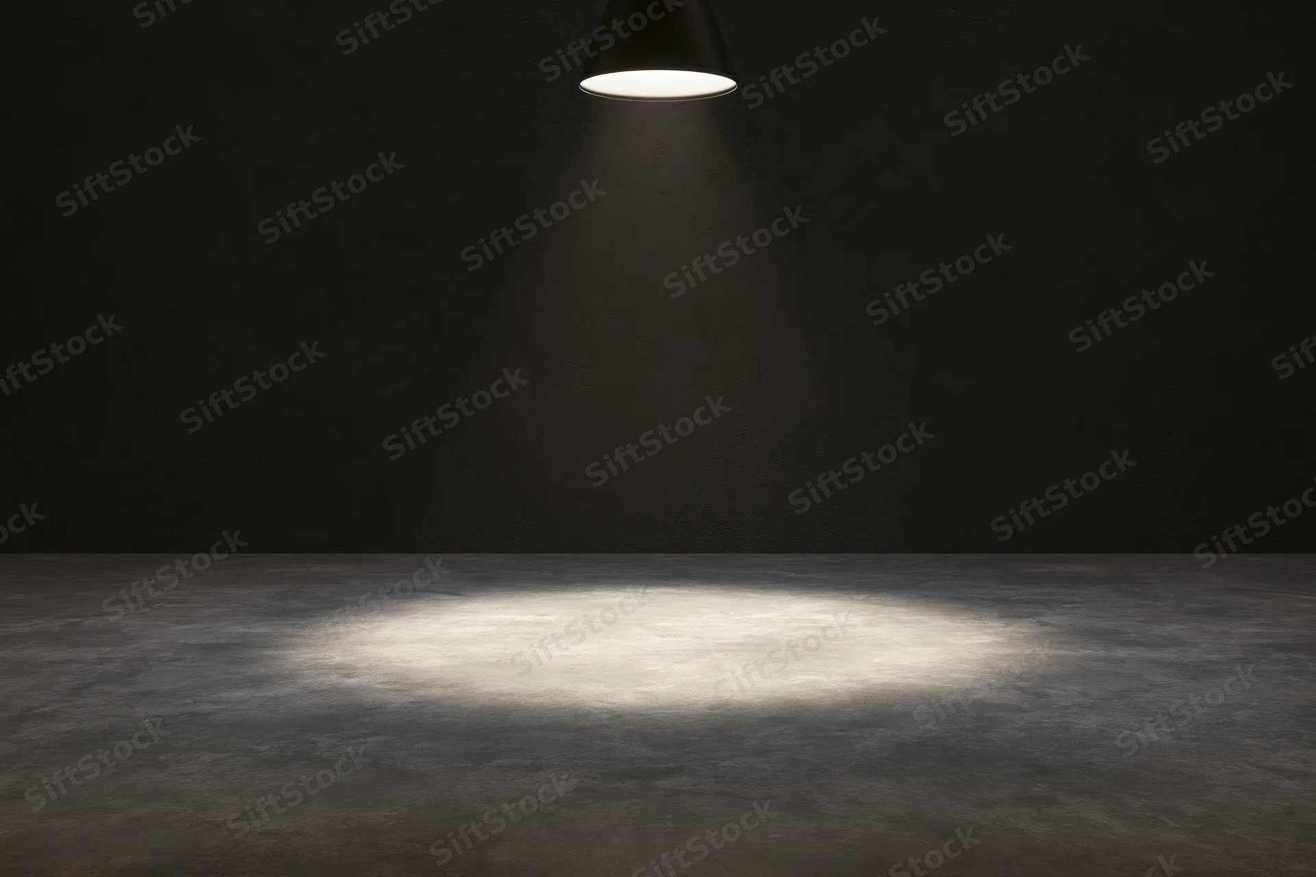 Single overhead spotlight casting a narrow cone of white light on a dark concrete floor in an empty room