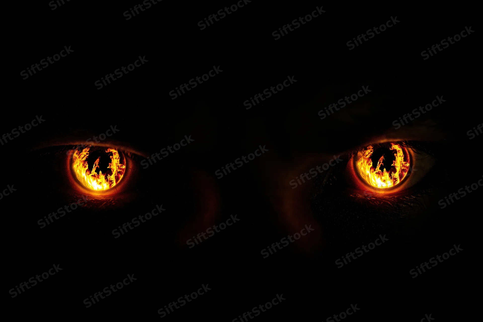 Glowing amber-orange eyes with fiery pupils in complete darkness
